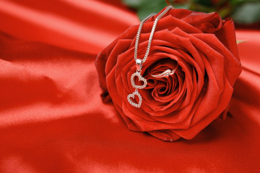 Valentine’s day necklace with two hearts pendant and a ring on red rose. Valentine’s day necklace with two hearts pendant and a ring on red rose.