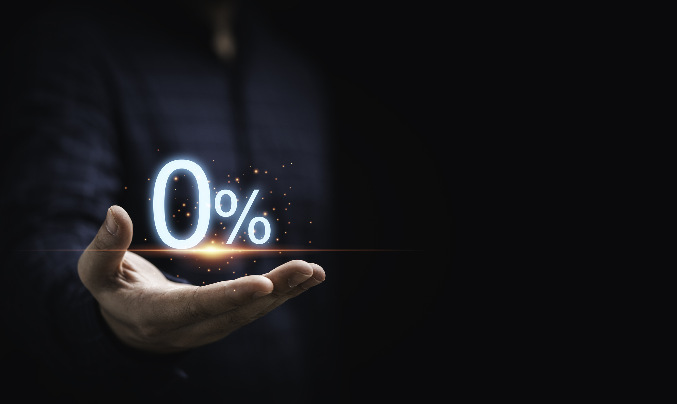 Businessman holding zero percentage on hand with copy space for sale discount promotion for Black Friday and merry Christmas happy new year period.