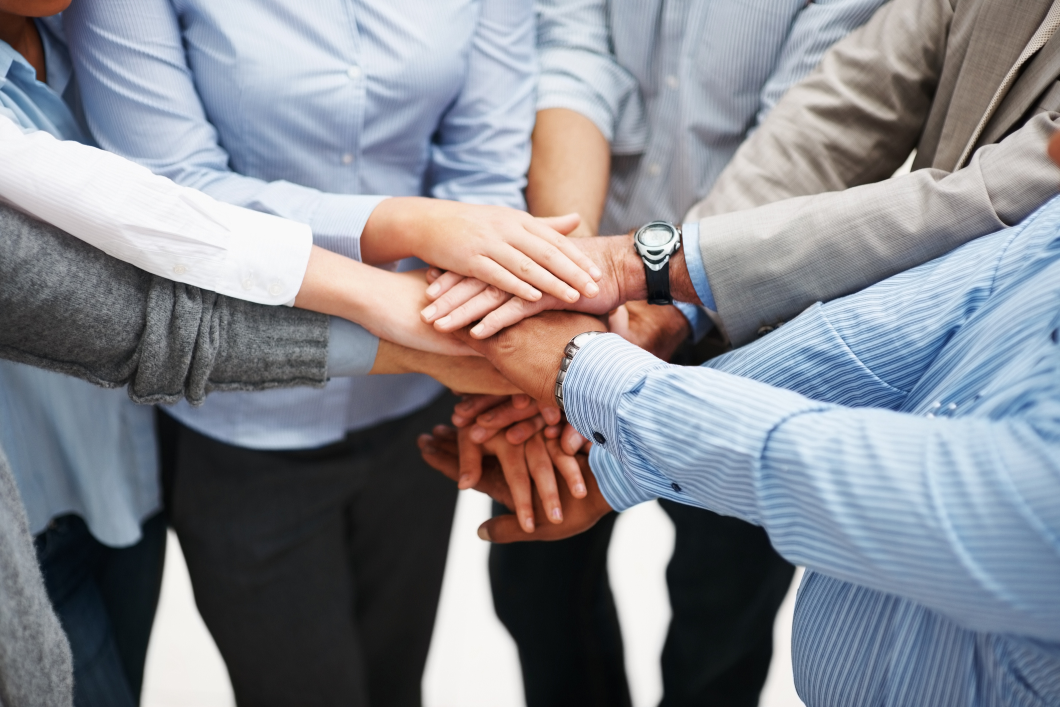 Closeup of a business people with hands together Closeup of a business people with hands together